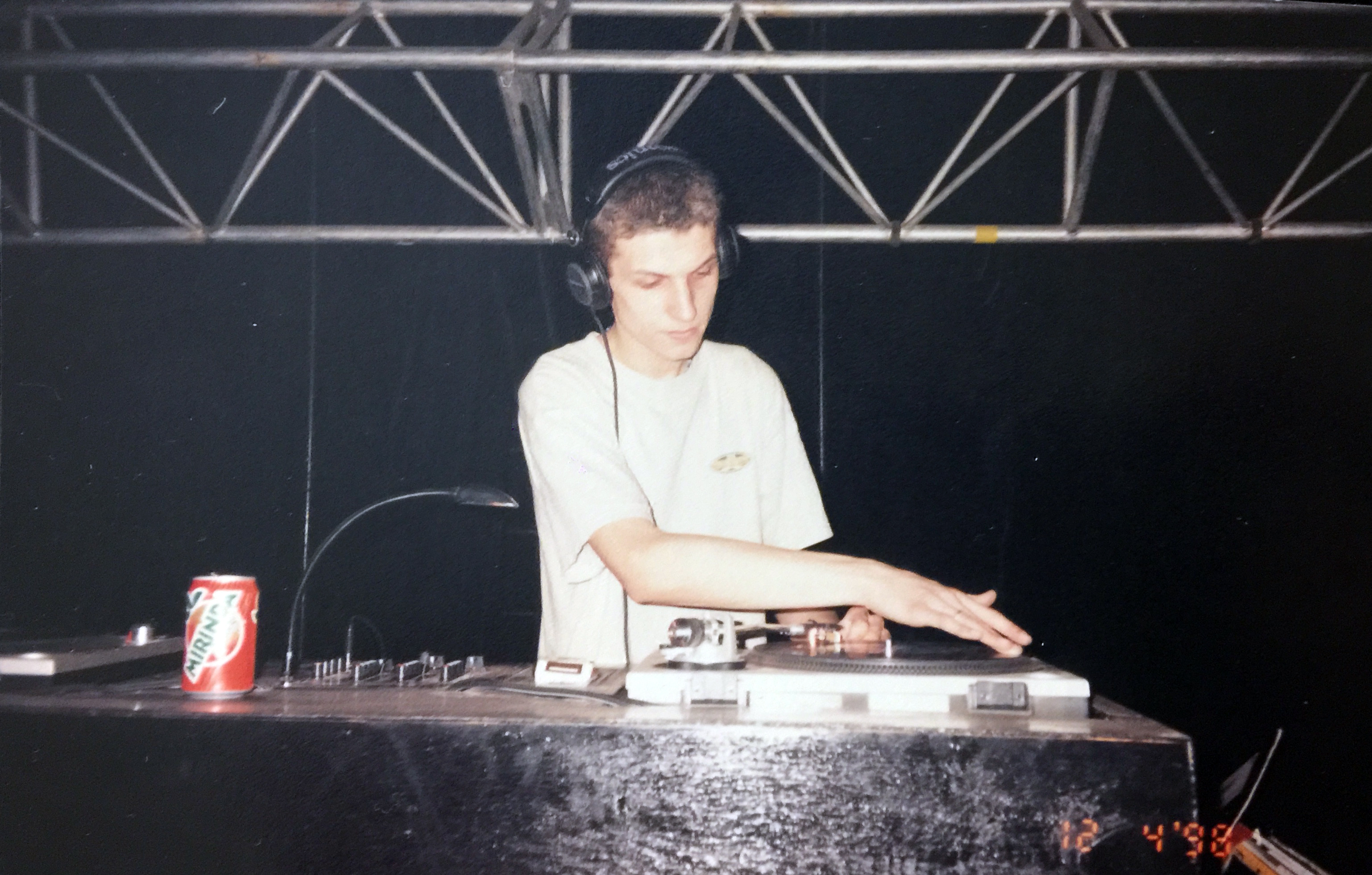 Working as DJ Basya at the Playoffs nightclub in Kyiv, aged 16 or 17. This photograph was taken at the beginning of the author's journey with drug use, when, as he reflects, "everything still felt fun." 1996–1997.